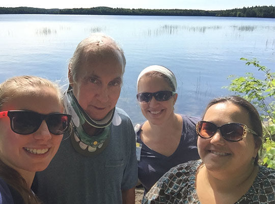 Patient at lake with therapists
