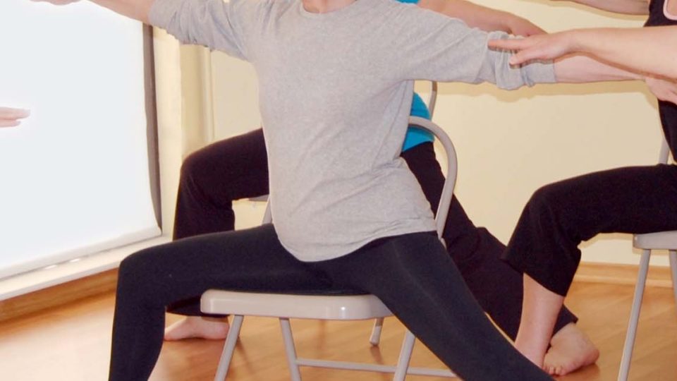 Patient doing chair yoga