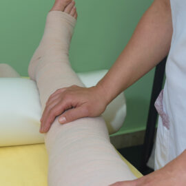 Picture of a leg wrapped in multilayer bandages to control Lymphedema. Part of complete decongestive therapy (cdt) and manual lymphatic drainage (MLD). 
