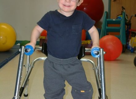 Child walking with special equipment