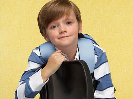 Young boy sitting in chair