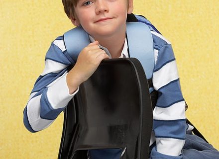 Young boy sitting in chair