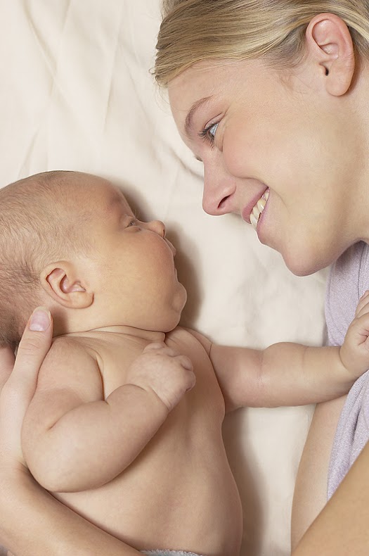 Mother and Baby smiling at eachother