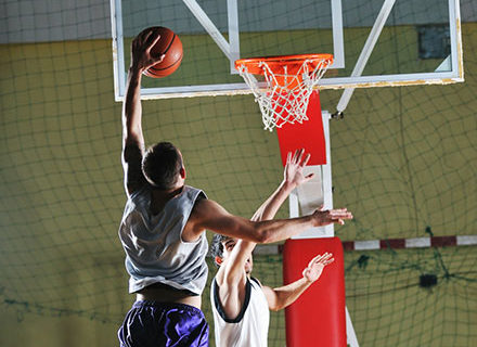 Men playing basketball