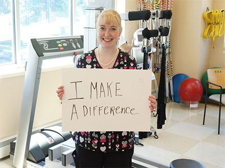 Employee holding sign that says I make a Difference
