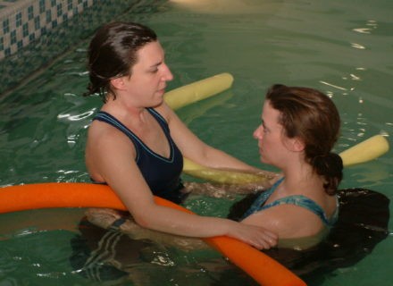 Patient in Pool with Therapist for aquatic therapy