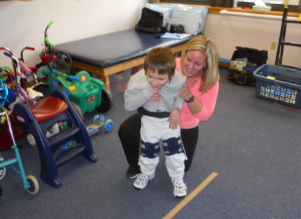 Child walking with orthotics