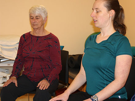 Patient and therapist doing neuro yoga
