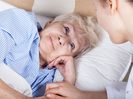 Patient Coach with patient at bedside