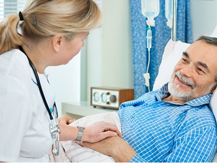 Nurse sitting with patient