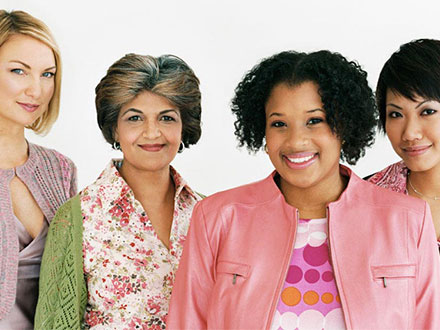 Four women smiling