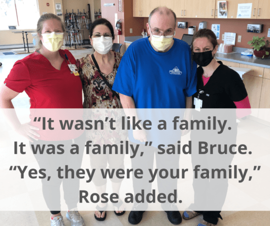 Photo of Bruce standing with his care team, whom he considers "family". 