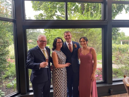 Photo of Doug and his family at a wedding. 