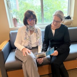 Cancer rehab care continues beyond a patient's stay. Here, the nurse is sharing some useful information with a patient. 